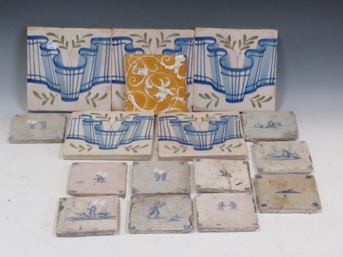 Lot 25 - A collection of blue and white delft tiles and...