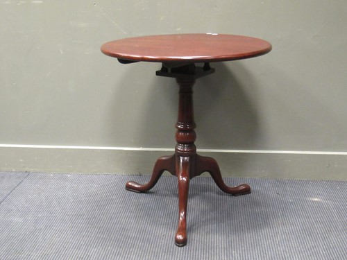 Lot 456 - A George III style mahogany revolving top wine...