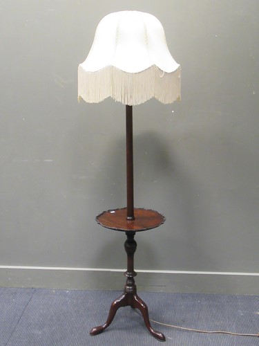 Lot 508 - A Georgian style mahogany standard lamp with...