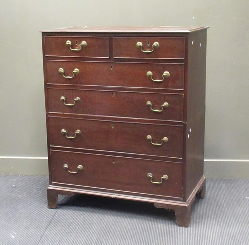 Lot 528 - A 19th century oak chest of drawers in two...
