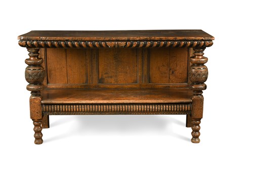Lot 132 - An Elizabethan and later carved oak two-tier buffet