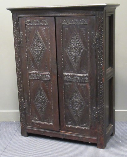 Lot 560 - A Jacobean style oak housekeepers cabinet with...