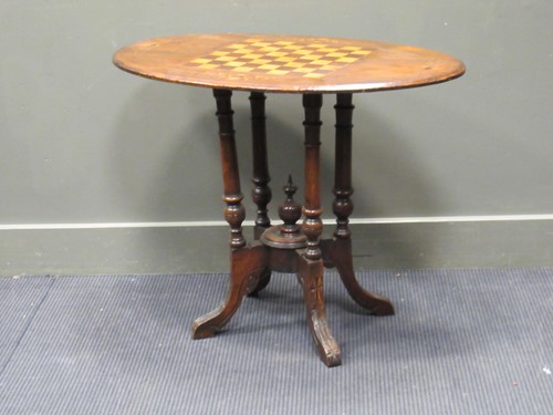 Lot 524 - A Victorian marquetry walnut oval games table...