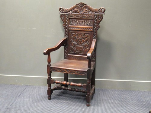 Lot 567 - A Victorian oak wainscot elbow chair with...
