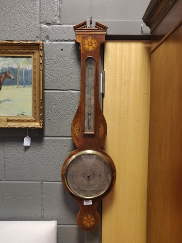 Lot 502 - A mahogany and paterae inlaid wheel barometer...
