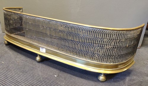 Lot 477 - A pierced brass fire guard 26 x 90 x 30cm