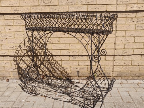 Lot 598 - A black painted wirework plant stand, 86.5 x...