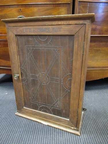 Lot 388 - A stained pine wall cabinet with single door...