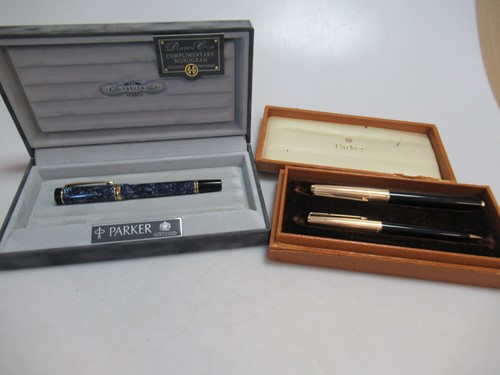 Lot 160 - A parker fountain pen with an '18K' nib, cased,...