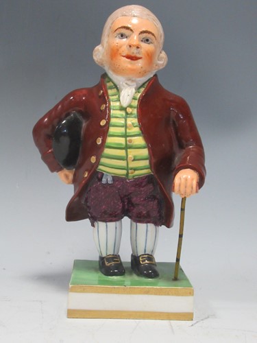 Lot 33 - A Derby figure of a Regency gentleman, marks...