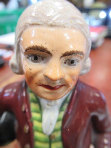 Lot 33 - A Derby figure of a Regency gentleman, marks...