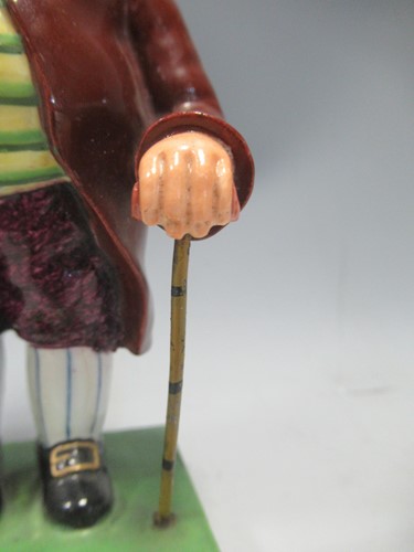 Lot 33 - A Derby figure of a Regency gentleman, marks...