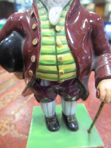 Lot 33 - A Derby figure of a Regency gentleman, marks...