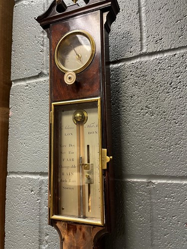 Lot 242 - A George III mahogany stick barometer by George Adams, London