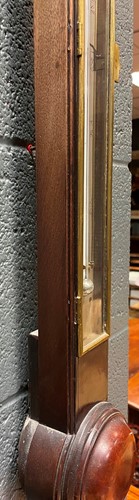 Lot 242 - A George III mahogany stick barometer by George Adams, London