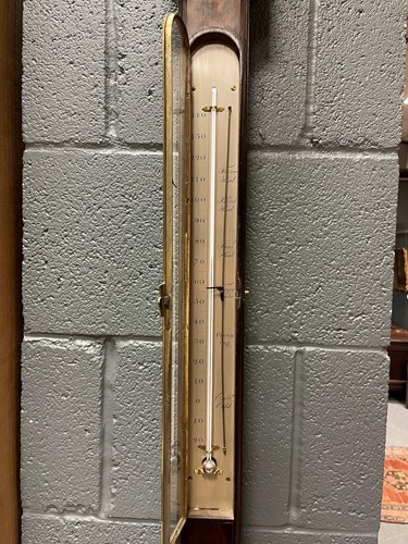 Lot 242 - A George III mahogany stick barometer by George Adams, London