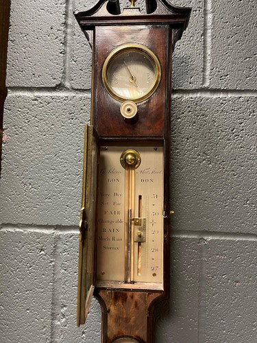 Lot 242 - A George III mahogany stick barometer by George Adams, London