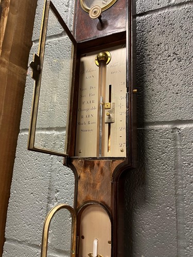 Lot 242 - A George III mahogany stick barometer by George Adams, London
