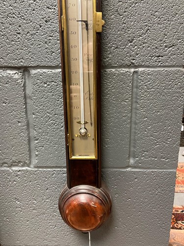 Lot 242 - A George III mahogany stick barometer by George Adams, London