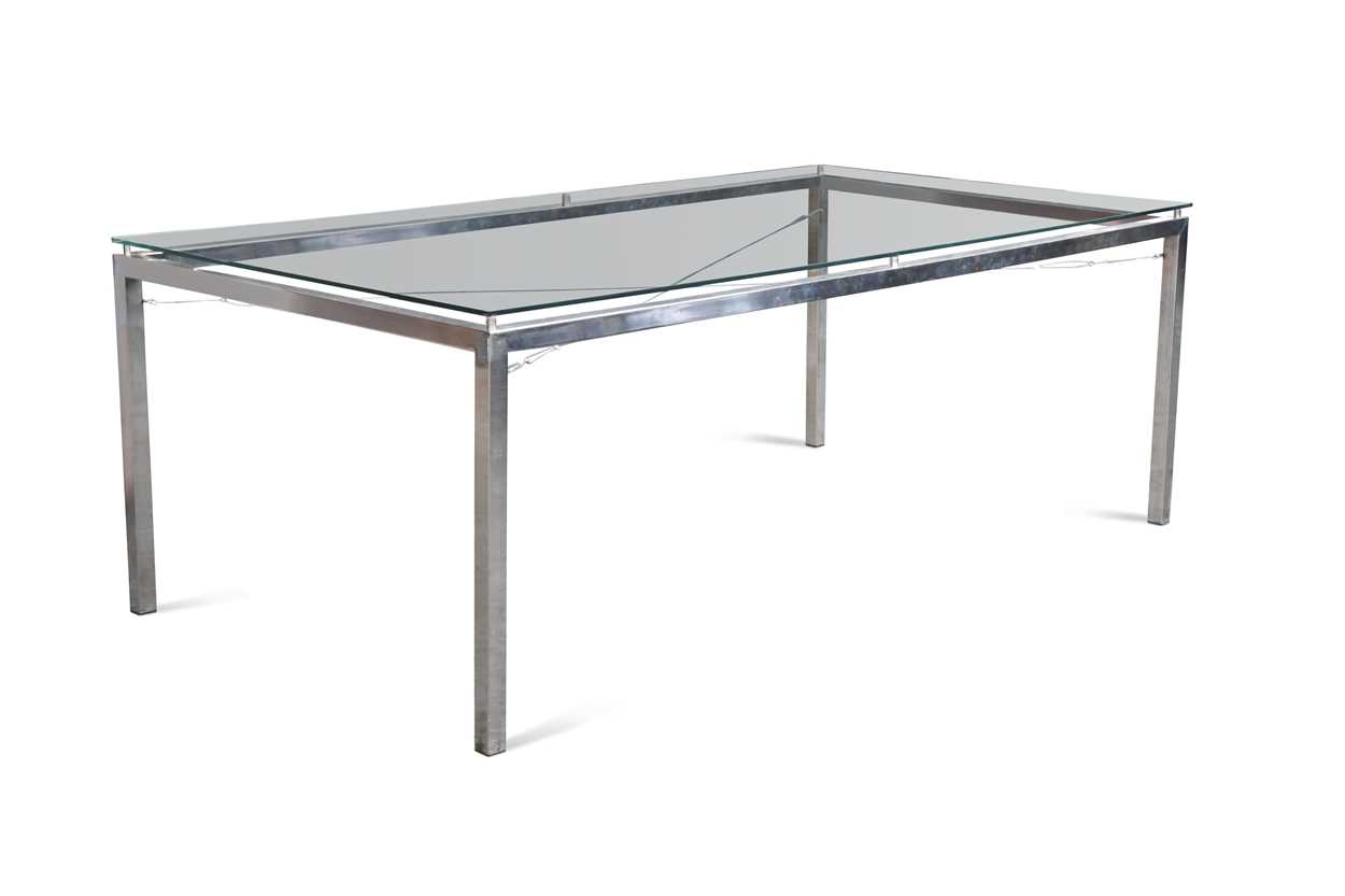 Lot 317 - A chrome and glass dining table by Artefacto of Sao Paulo, Brazil