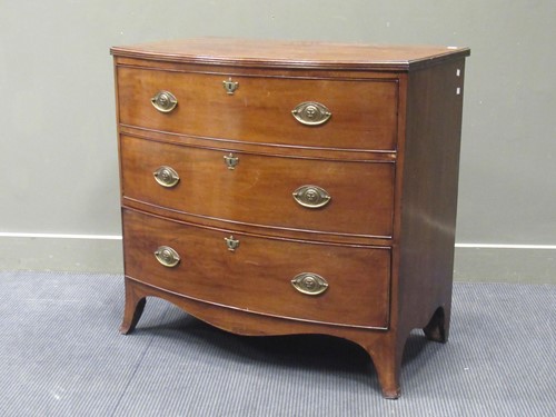 Lot 417 - An early 19th century mahogany bow front chest...