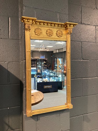 Lot 451 - An early 19th century gilt framed pier glass,...