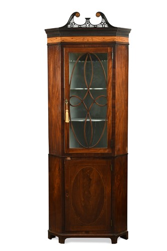 Lot 408 - A George III mahogany floor standing corner cupboard