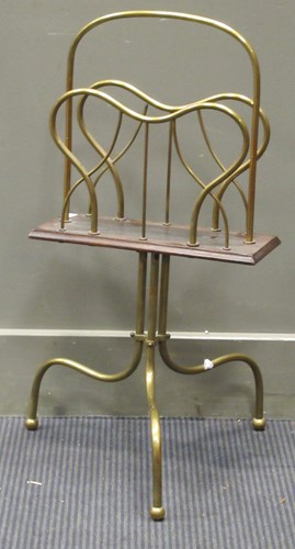 Lot 403 - A brass magazine rack on tripod base, 69cm high
