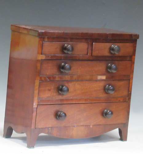 Lot 105 - A 19th century miniature mahogany chest of...