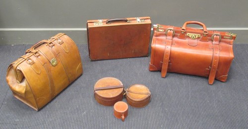 Lot 99 - A leather gladstone bag and two leather...