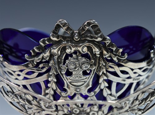Lot 459 - A (probably) German metalwares silver swing handled sugar basket