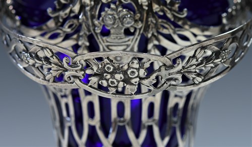 Lot 459 - A (probably) German metalwares silver swing handled sugar basket