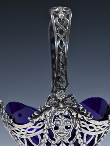 Lot 459 - A (probably) German metalwares silver swing handled sugar basket