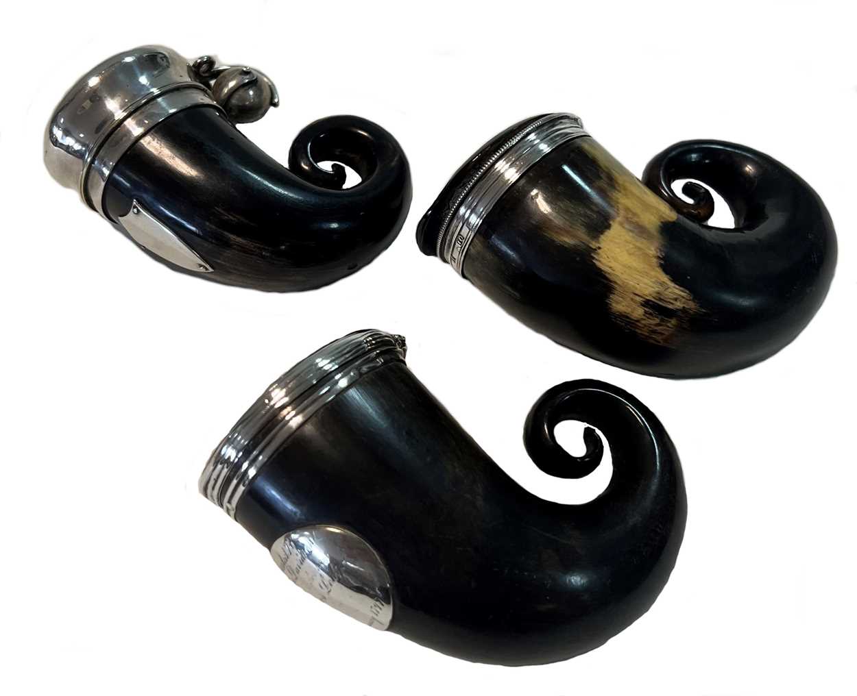Lot 401 - A trio of silver mounted ram's horn snuff mulls