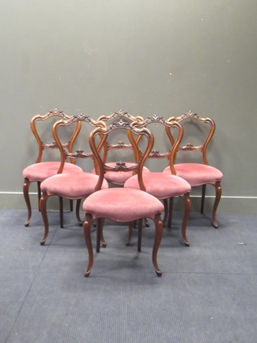 Lot 446 - A set of six Victorian walnut dining chairs on...