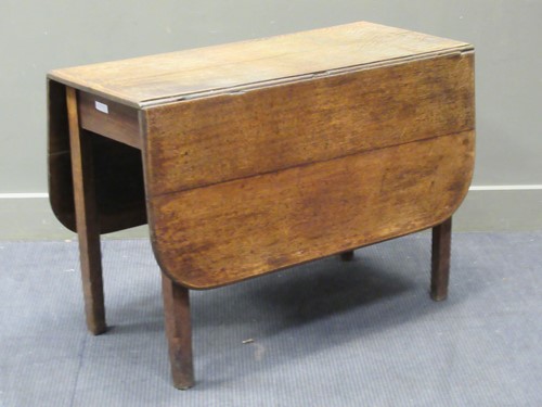 Lot 387 - An oak drop flap table, 69 x 98 x 46cm...