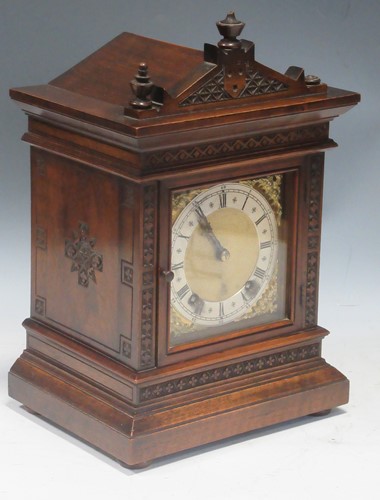 Lot 78 - An Edwardian oak bracket clock, and a leather...