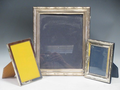 Lot 195 - A group of three modern silver photo frames,...
