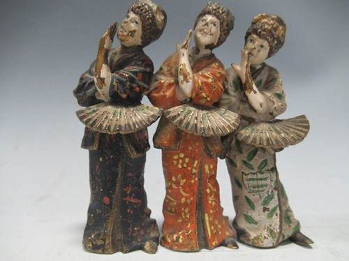 Lot 35 - A cold painted metal model of three Geisha girls