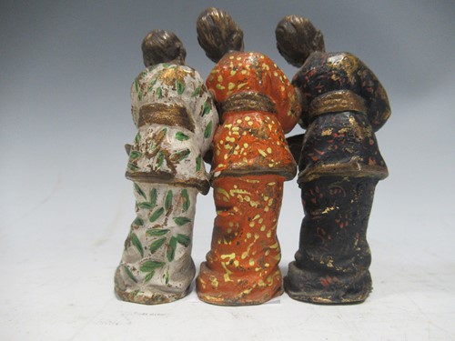 Lot 35 - A cold painted metal model of three Geisha girls