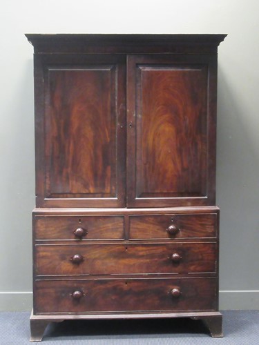 Lot 358 - A 19th century mahogany linen press, the Greek...