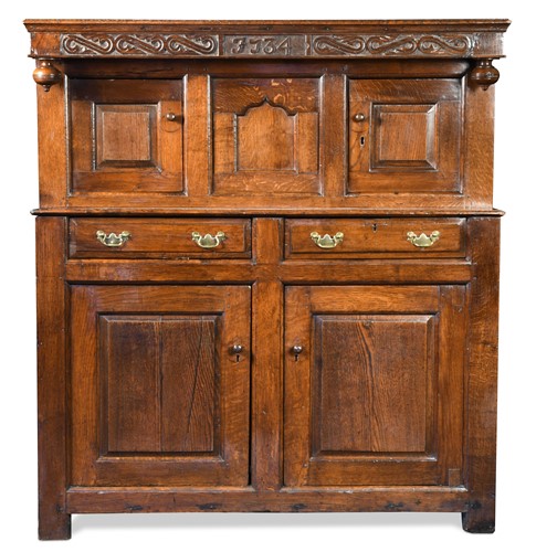 Lot 130 - An oak court cupboard