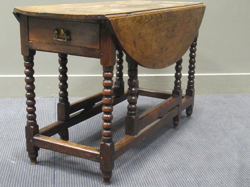 Lot 416 - An 18th century and later oak gateleg table on...