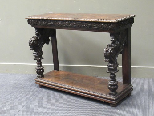 Lot 468 - A Victorian carved oak console table with...