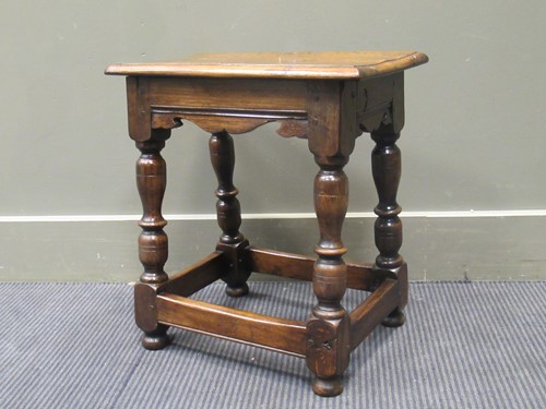 Lot 363 - A 17th century style oak stool with turned...