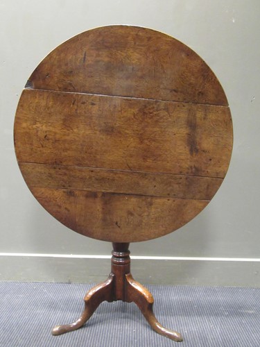Lot 448 - A 19th century country made oak tilt-top...