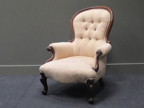 Lot 441 - A Victorian spoon back walnut framed armchair...