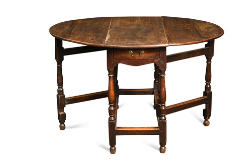 Lot 128 - An oak oval gateleg table, 18th century