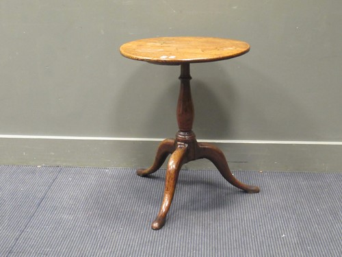 Lot 471 - A small George III oak tripod table, the...