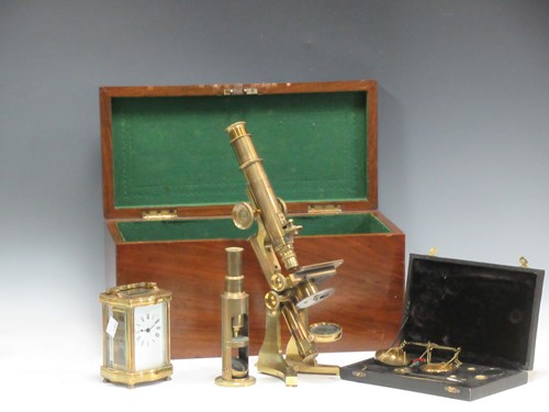 Lot 89 - A brass microscope by Wood, and a basic...